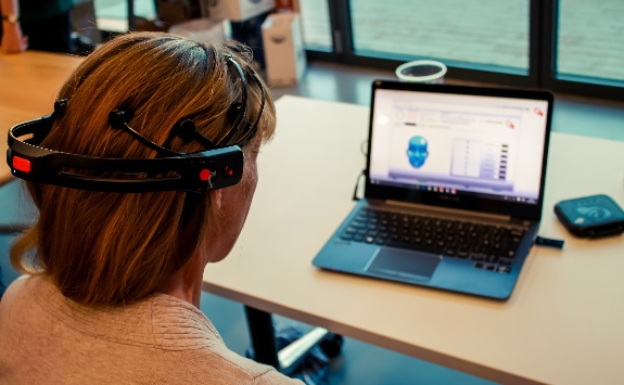 Person sitting at a computer taking part in an experiment